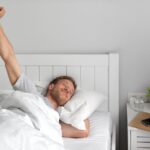 medium shot man waking up 1 Better Sleep, Better Mood: The Hidden Role of Your Mattress