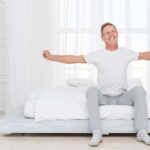 full-shot-man-stretching-morning (1)