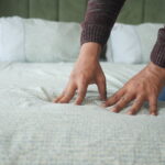 man hand touching pressing orthopedic mattress bed 1 Mattress Sagging Prevention Best Mattress for Couples Mattress Sagging Prevention: Why Mattresses Sag Over Time and How to Stop It